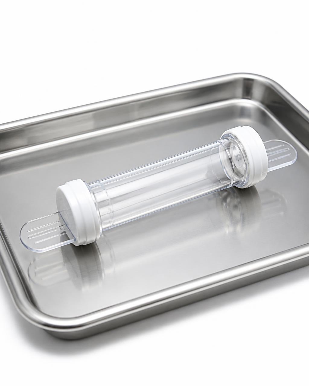 Clear acrylic Leech Latcher applicator tube on a sterile surgical tray